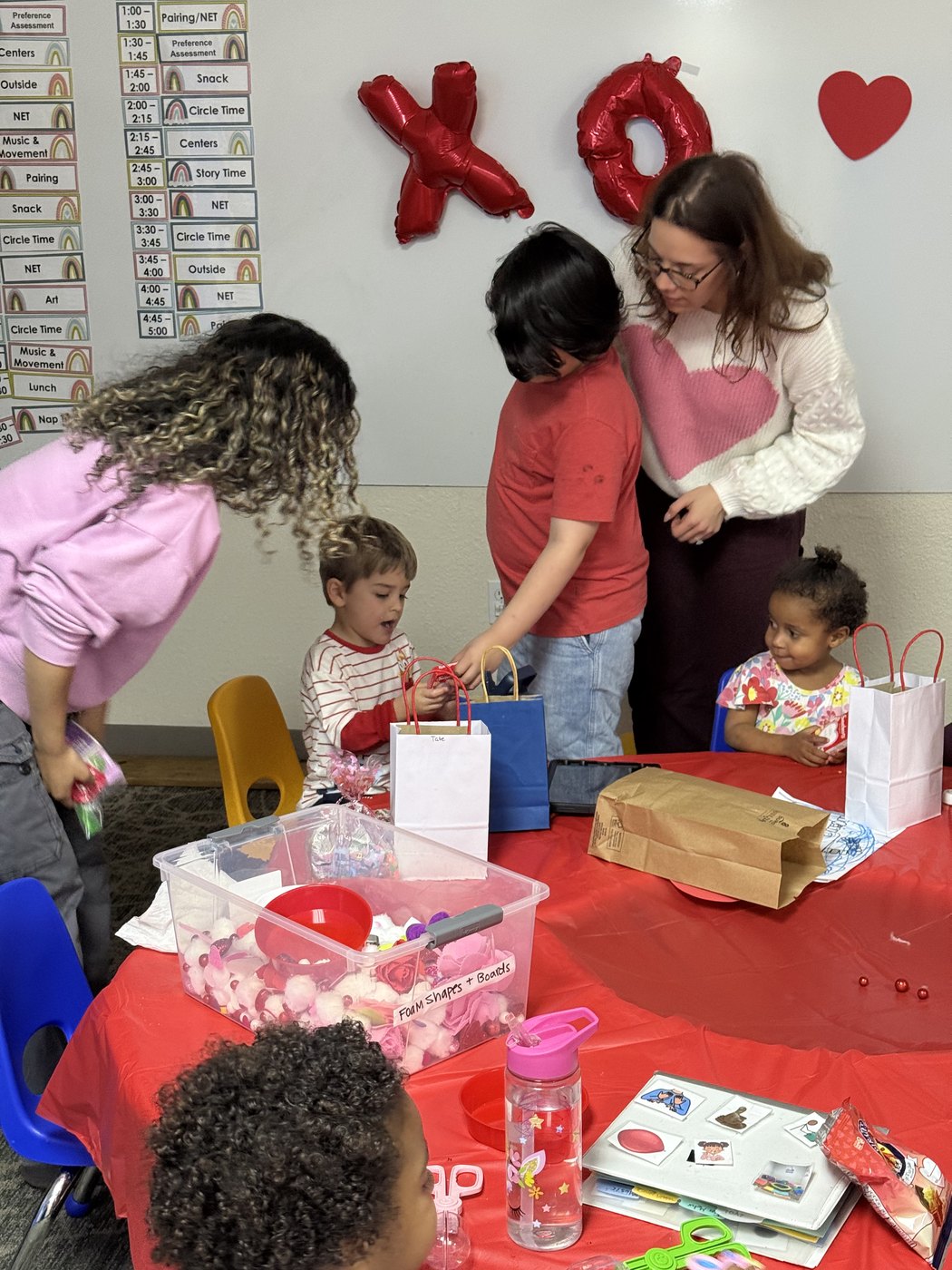 Children and a therapist during a group activity at Creative Learning's ABA center in Cocoa